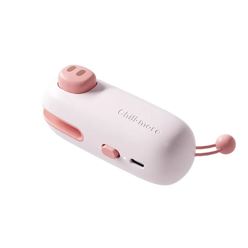 Pink handheld bag sealer machine with USB charging port and cartoon design