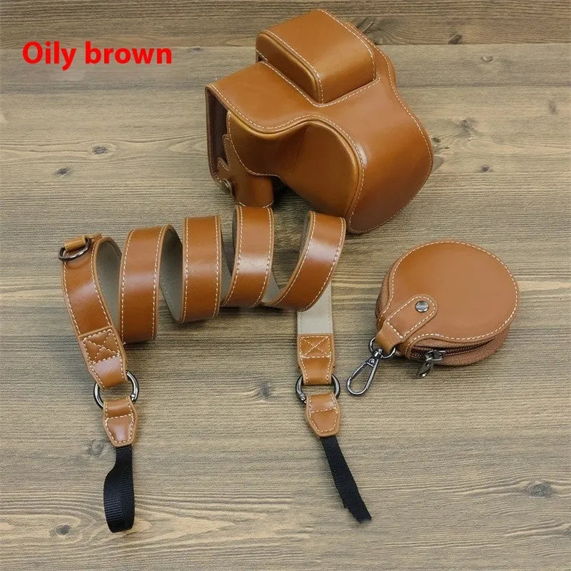 PU shoulder bag for a single mirrorless camera, shown in oil skin or palm print finish