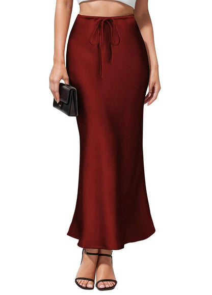 Asymmetric high waist acetate skirt with irregular stitching in multiple colour options.