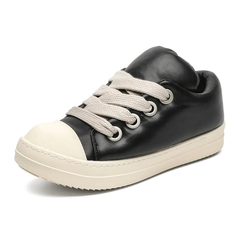 Black men's slip-on casual shoes with leather upper, rubber sole, and raised platform design