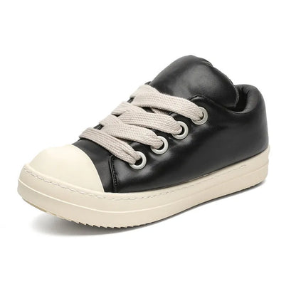 Black men's slip-on casual shoes with leather upper, rubber sole, and raised platform design