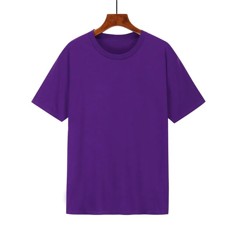 A man's loose-fitting black cotton T-shirt with short sleeves on a hanger.