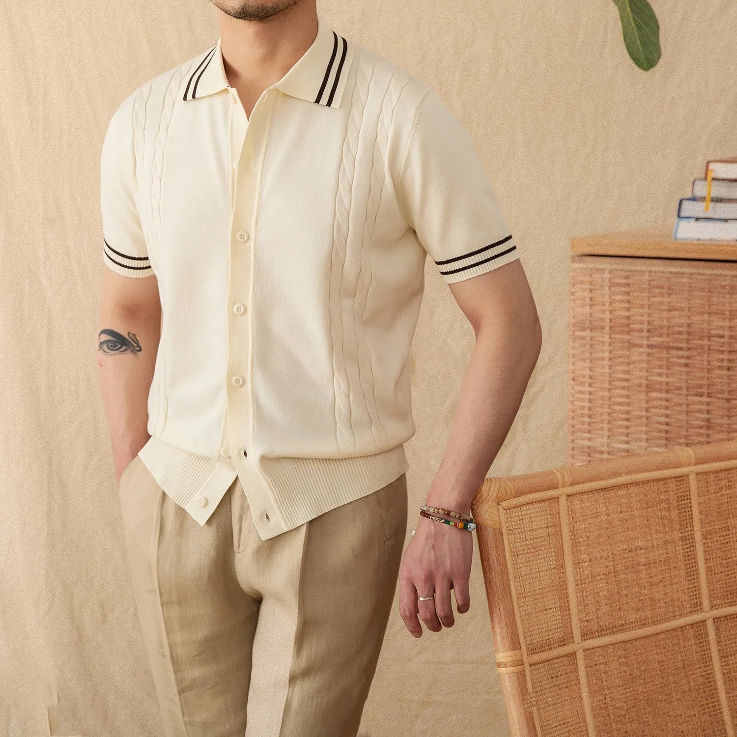 Men's apricot-coloured short-sleeved polo shirt with a lapel collar, laid flat.
