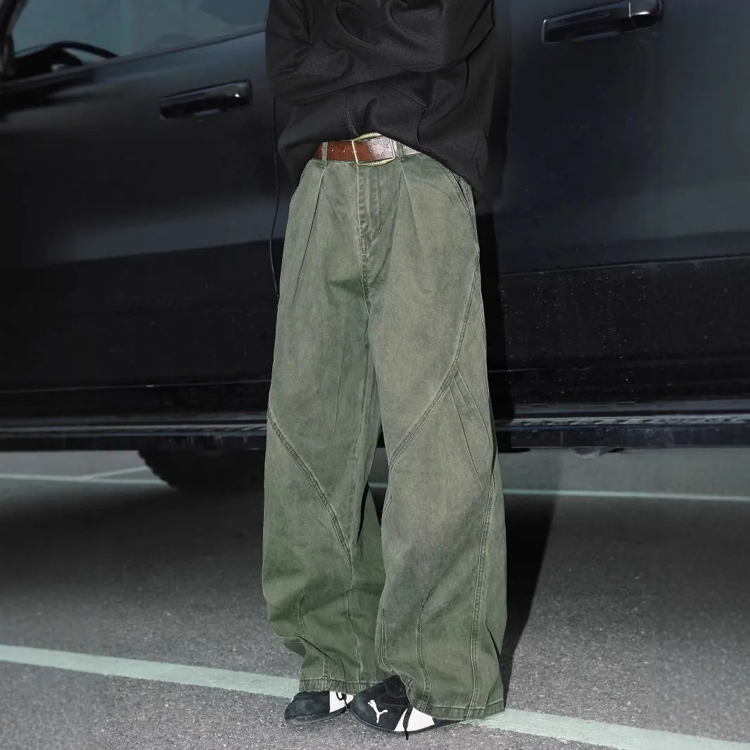 Man wearing pleated straight-leg trousers in a striped pattern with a micro elastic mid waist.