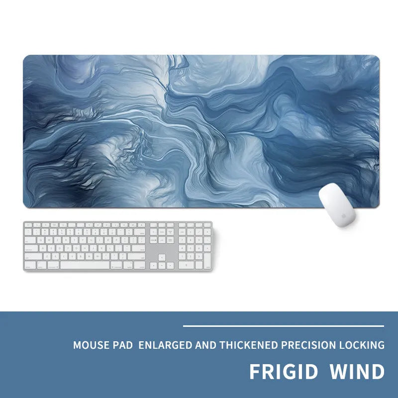 Oversized rectangular mouse pad with a printed design on a desk, next to a keyboard and mouse.