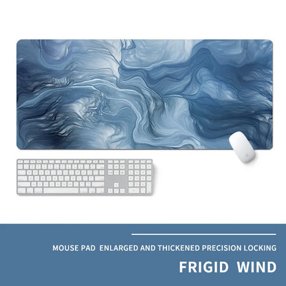 Oversized rectangular mouse pad with a printed design on a desk, next to a keyboard and mouse.