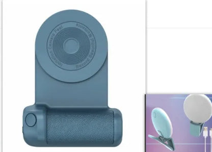 Black magnetic phone camera grip with rotatable bracket and ergonomic PU leather handle on a table.