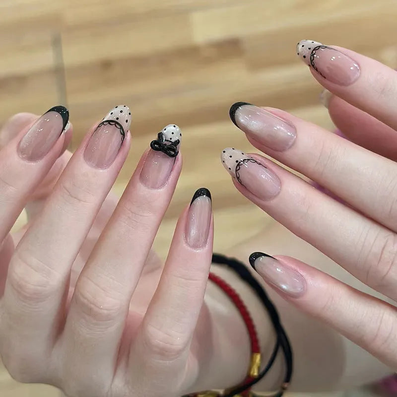 Five packs of reusable coloured false fingernails with various designs.