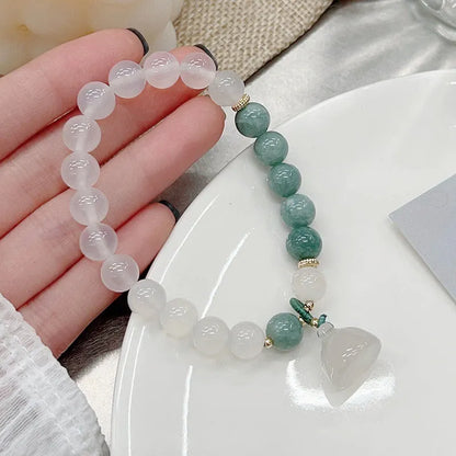 Women's retro Chinese style agate lotus seedpod bracelet showing natural stone patterns