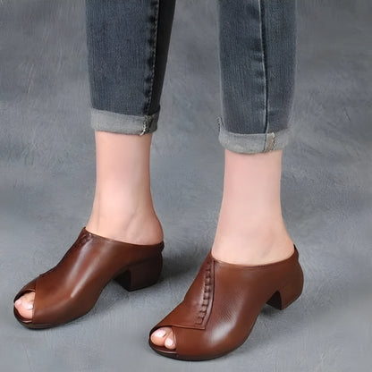 Women's black square heel peep-toe slippers with a rubber sole and fish mouth scaffold design.