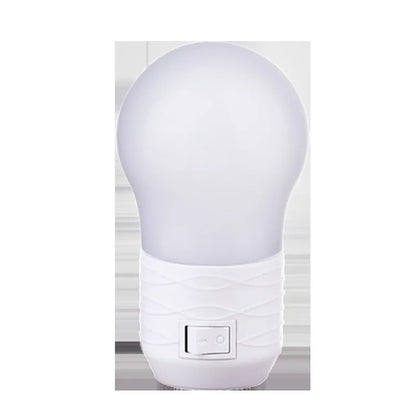 Plug-in bedside baby night light in white, blue, or pink shell with round shape.