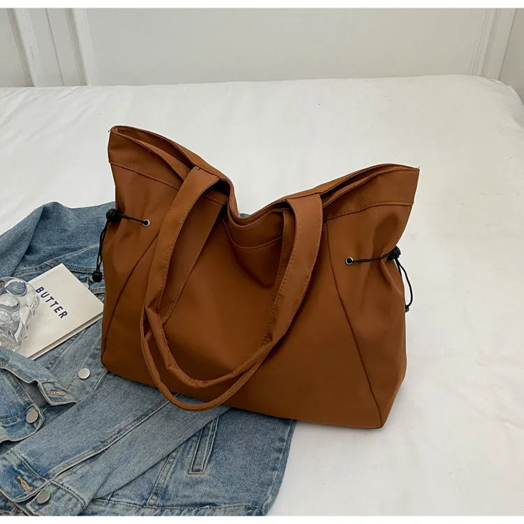 Soft Oxford cloth foldable commuter tote bag in street trend style, shown in available colours.