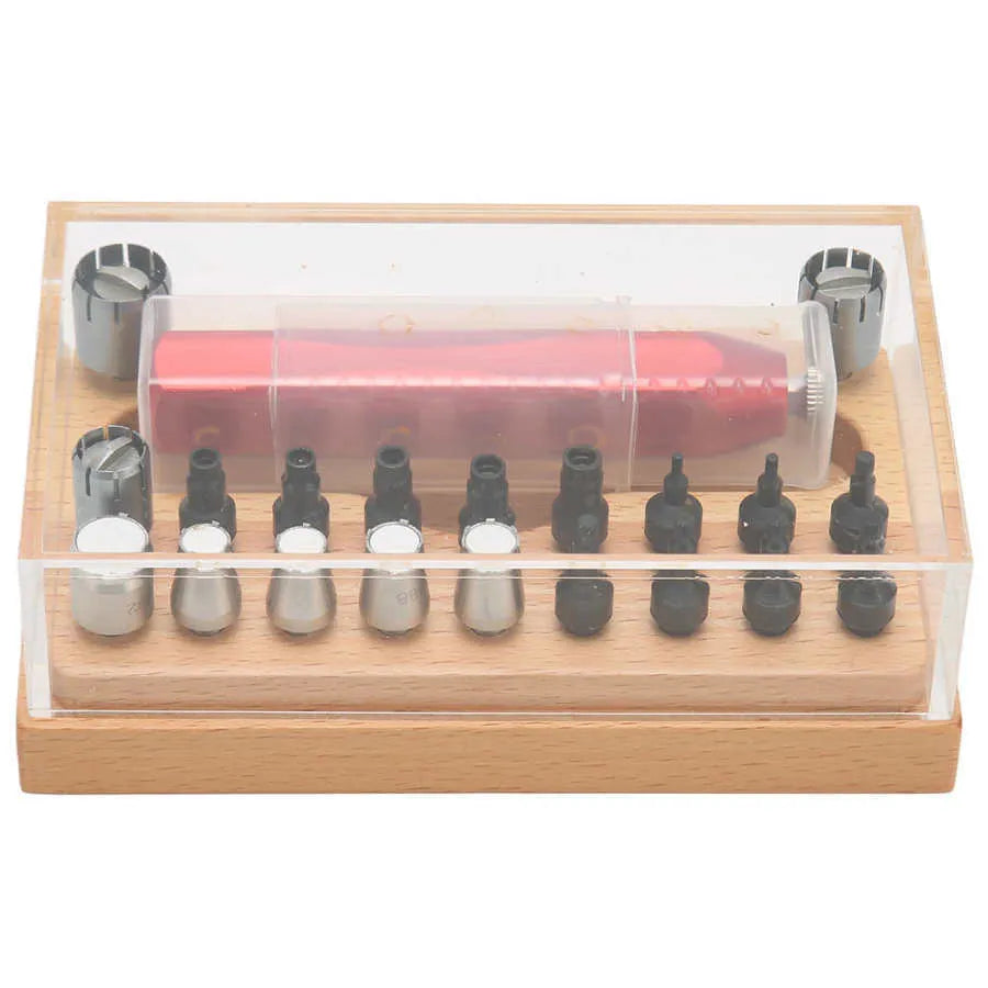 20-piece steel watch case opening tool set laid out on a surface