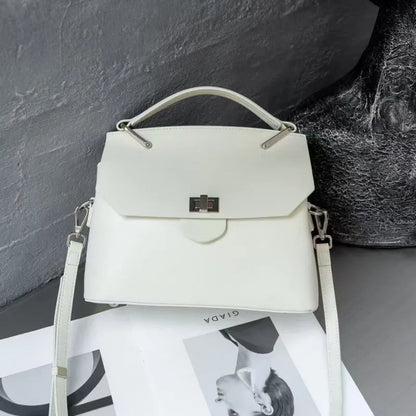 Genuine vegetable-tanned leather messenger bag in urban simplicity style with internal organisation pockets