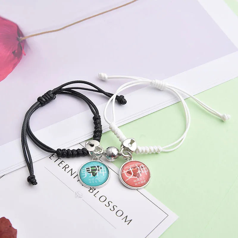 A pair of magnet couple bracelets with a suction clasp, showing various design options like clovers, crowns, and hearts.