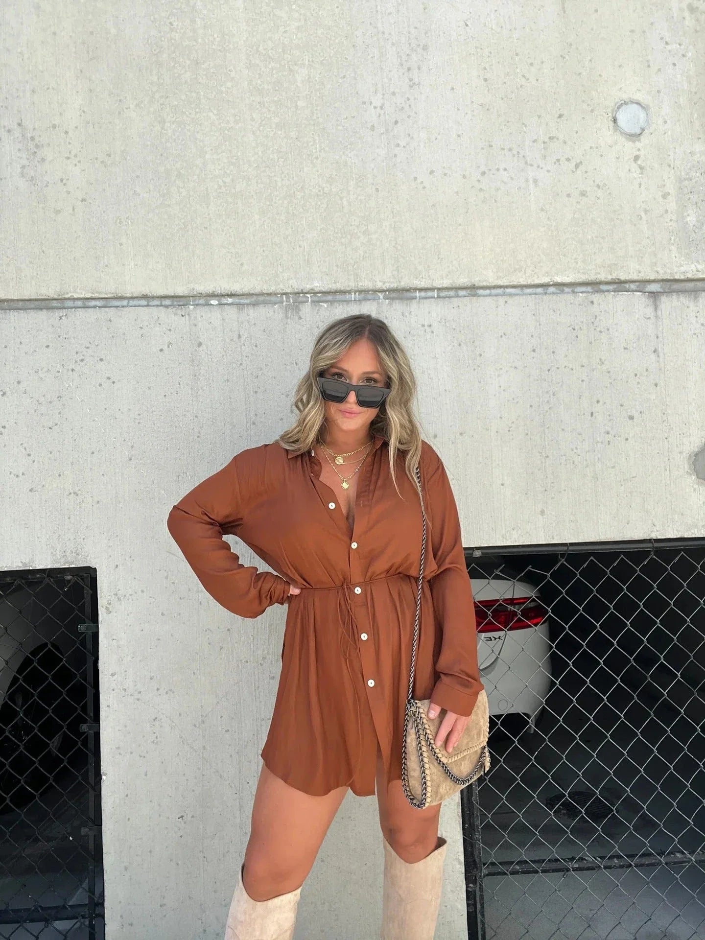 A stylish long sleeve jumpsuit with a button-up shirt design, available in a variety of vibrant colors.