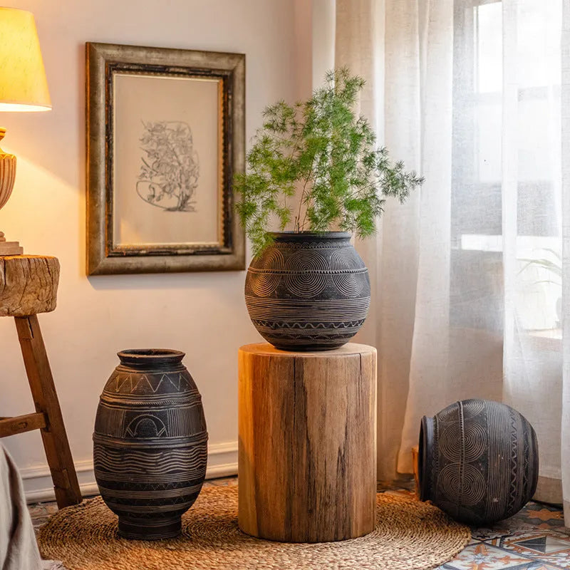 Medium cement African Ancient Tank style flower pot with a textured finish and drainage hole.