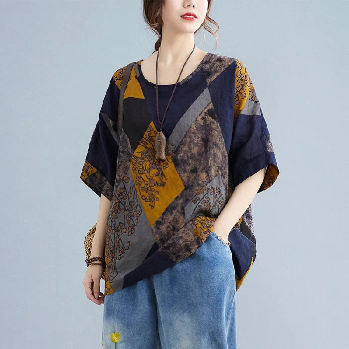 Stylish women's retro-inspired t-shirt in vibrant yellow, red, and brown printed design
