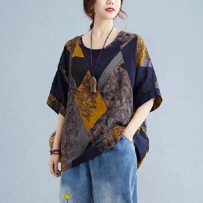 Stylish women's retro-inspired t-shirt in vibrant yellow, red, and brown printed design