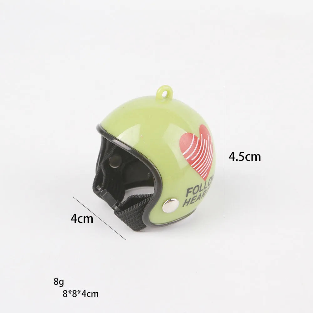 Small hard plastic helmet with elastic straps and sponge lining, designed for a chicken or bird to wear.