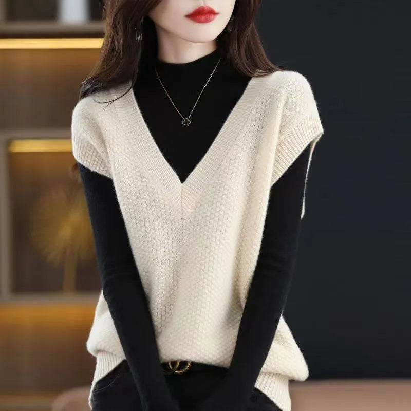 Creamy-white sleeveless V-neck knit vest with a raised 3D stereoscopic pattern on the front.