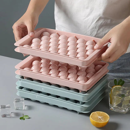 Sky blue and pink 3D round ice moulds creating spherical ice balls for drinks