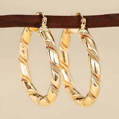 Geometric copper ear clips for women with ring and line elements in golden colours