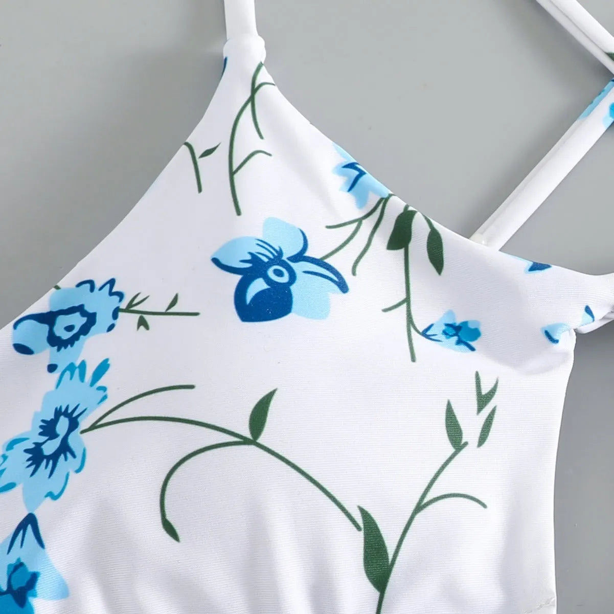 Floral tie-neck triangle bikini top with matching ruffle shorts swimsuit set