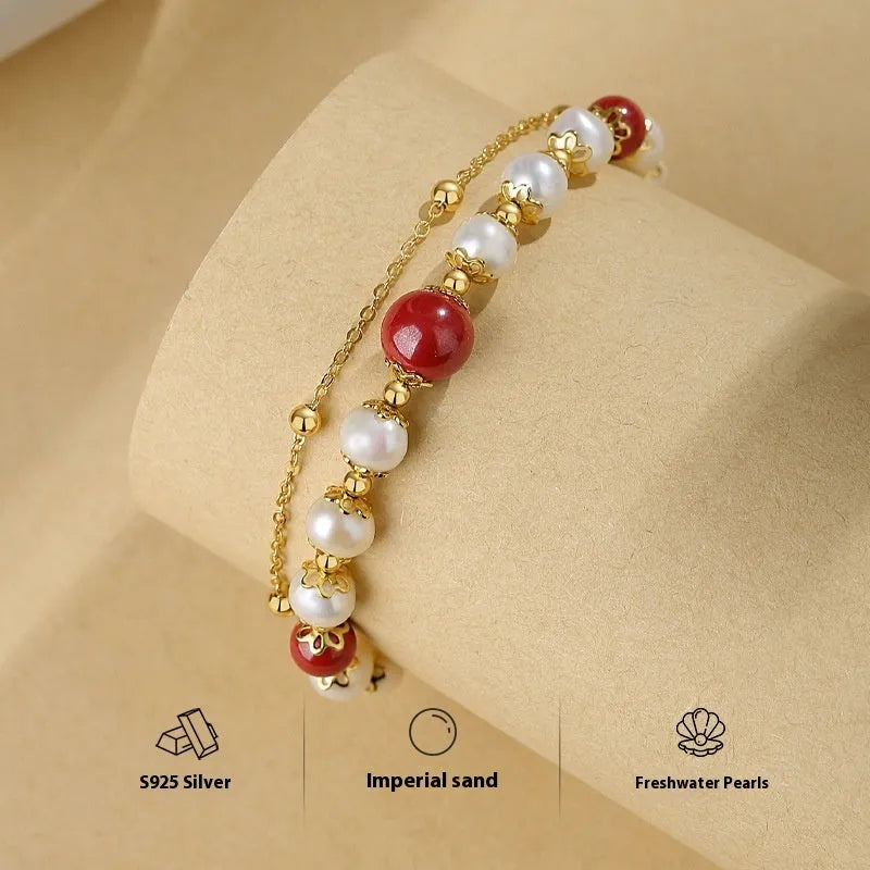 Double-layer women's bracelet with freshwater pearls and geometric cinnabar beans on sterling silver