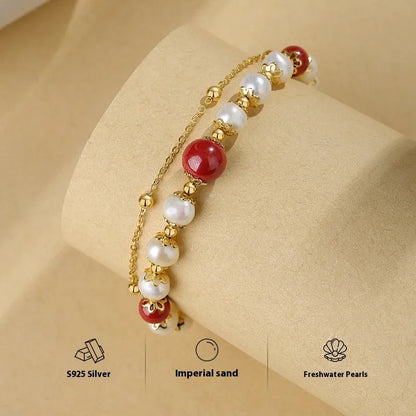 Double-layer women's bracelet with freshwater pearls and geometric cinnabar beans on sterling silver
