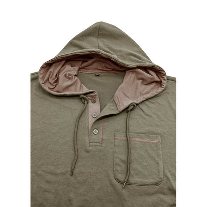 Man wearing a grey hooded henley long-sleeved t-shirt, showcasing the pullover style and cotton blend fabric.