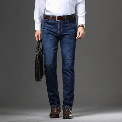 Men's straight-leg stretch jeans in black or blue denim with a zip fly, shown laid flat.