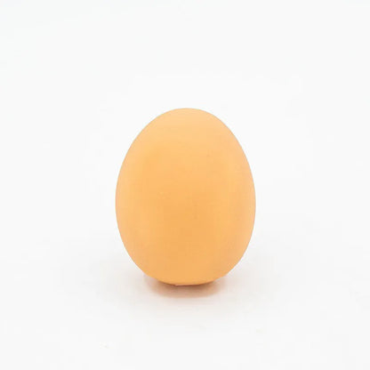 Durable rubber dog chew toy shaped like an egg with sound simulation for puppy teeth cleaning