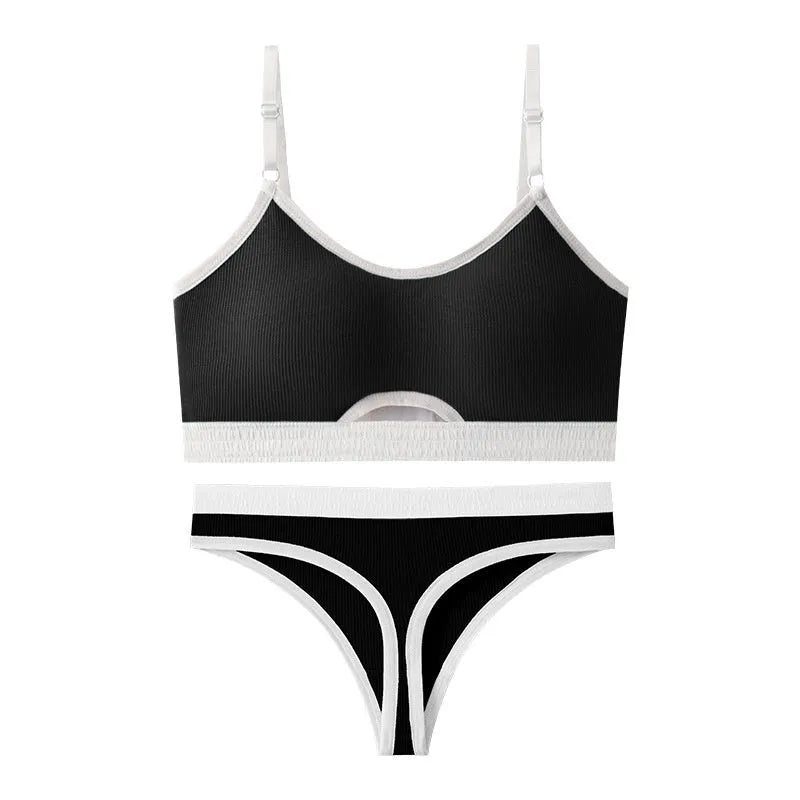 White underwired sports bra set with contrast dark grey back detailing and matching briefs on a mannequin.