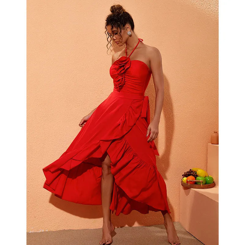 Red women's V-neck halter swimsuit with open back and a matching detachable long skirt laid flat.