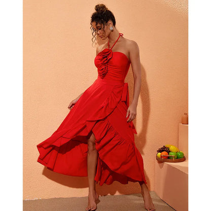 Red women's V-neck halter swimsuit with open back and a matching detachable long skirt laid flat.