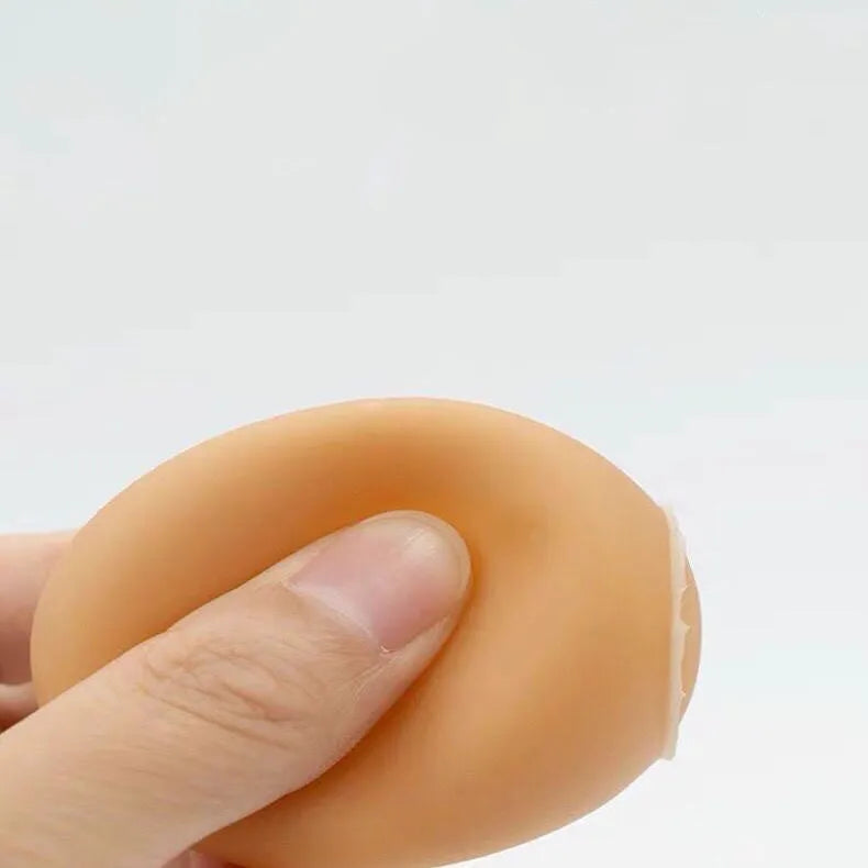 Durable rubber dog chew toy shaped like an egg with sound simulation for puppy teeth cleaning