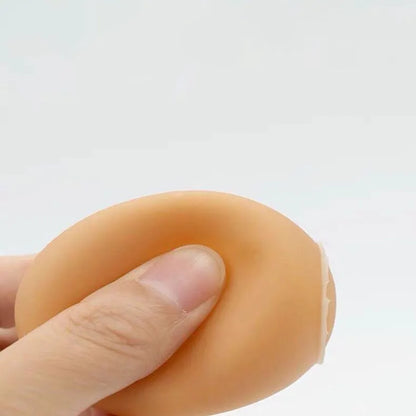 Durable rubber dog chew toy shaped like an egg with sound simulation for puppy teeth cleaning