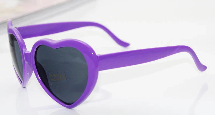 Fashionable heart-shaped light-up glasses with a built-in LED lighting system, perfect for adding a touch of love and playfulness to any occasion.