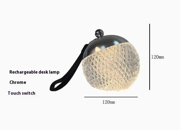 Small portable desk lamp with touch dimmer in gold finish, 12cm tall.