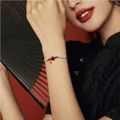 Women's Hetian jade and cinnabar red rope bracelet with adjustable 925 silver chain