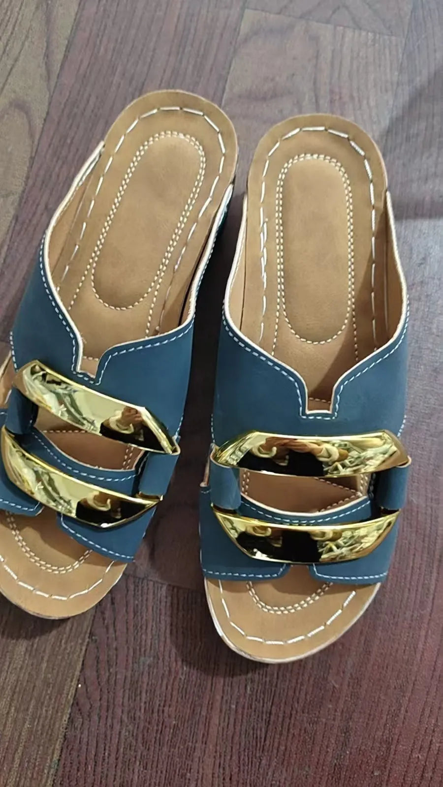 Roman-style platform flip-flop sandals in black, white, khaki, and sea blue on a rubber sole.