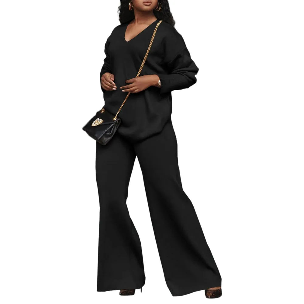 Women's brown suede two-piece suit with split sleeves on top and matching trousers