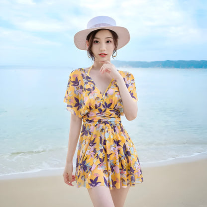 Yellow floral pattern women's one-piece swimsuit on hanger