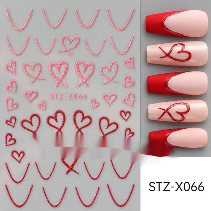 Assortment of black and silver nail sticker designs including cartoon and French tip patterns on a plastic sheet.