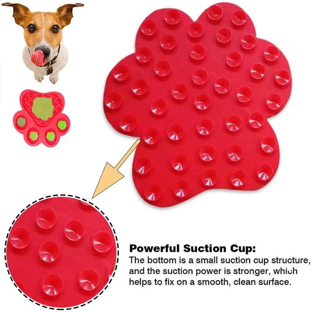 Bone-shaped blue silicone dog licking mat with suction cups on a tile surface