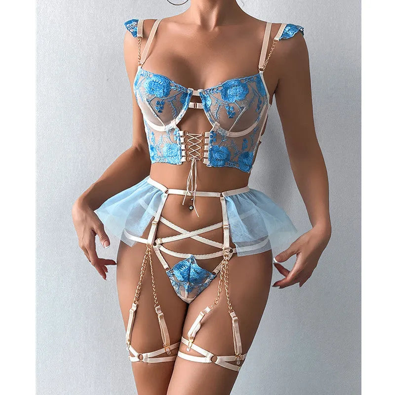 Light blue embroidered lace push-up bra and matching underwear set with mesh panels on a mannequin.