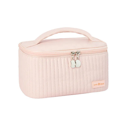 Open-top pastel pink PU leather makeup bag with a flat base, showing interior space.