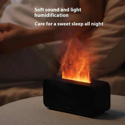 White USB aroma diffuser with glowing flame simulation and mist output on a wooden table.
