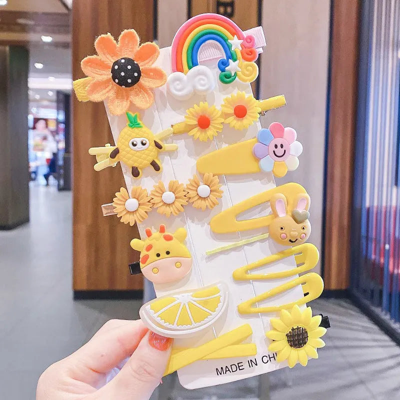 Assortment of colourful toddler hair clips and barrettes with candy, rainbow, fruit, and butterfly designs